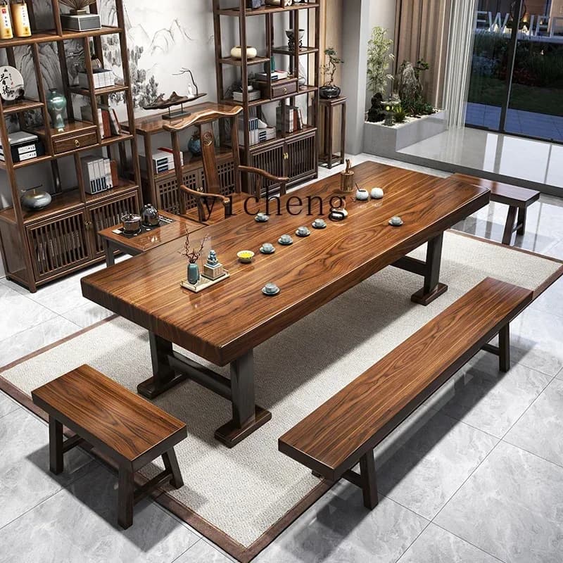 Large polished solid wood tea table with matching benches and chairs in a traditional Chinese style.