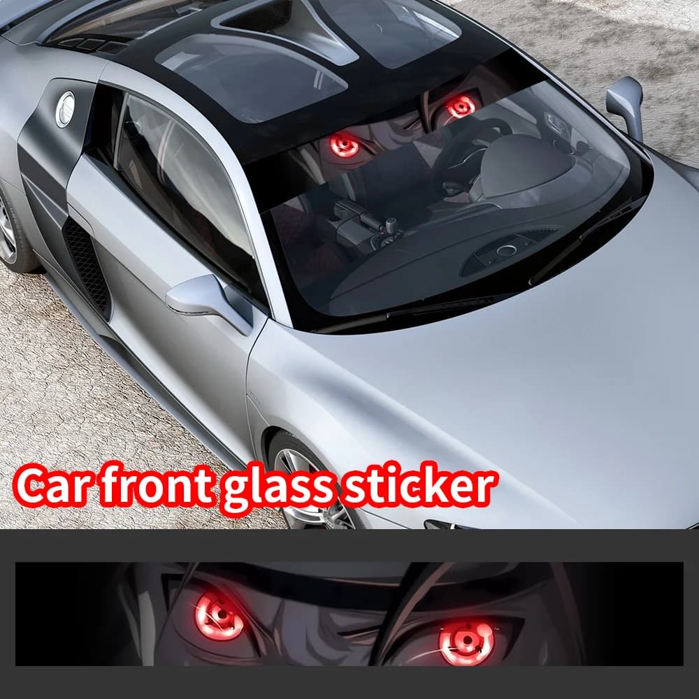 Anime 3D eyes vinyl decal banner on a silver car front windshield.