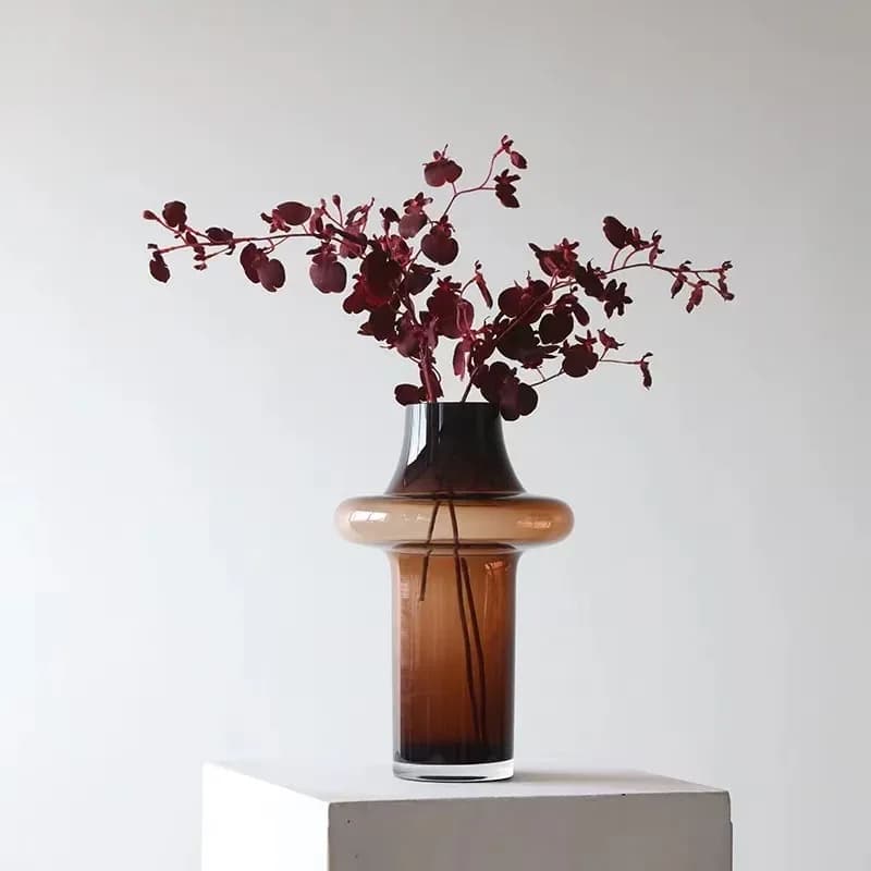 Sleek brown-tinted designer art glass vase for living room decor.
