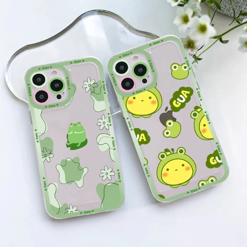 Two mint green iPhone cases featuring cute cartoon frog and floral illustrations.