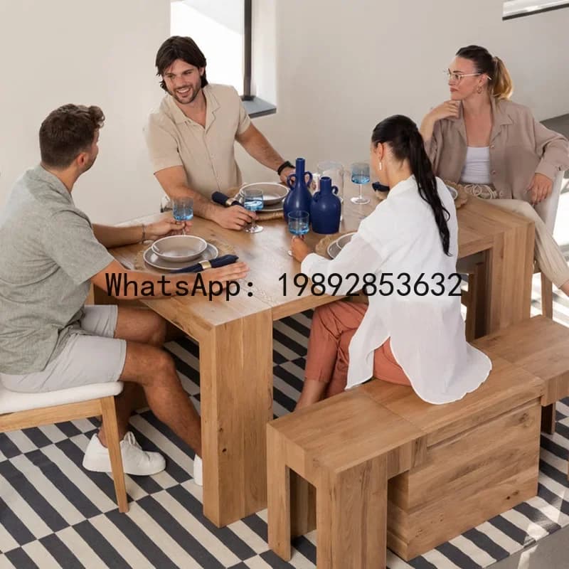 A group of four friends enjoying a meal at a solid wood extendable dining table with modular seating.