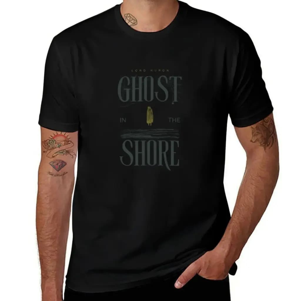 A man wearing a black short-sleeve t-shirt with a Lord Huron Ghost In The Shore graphic design.