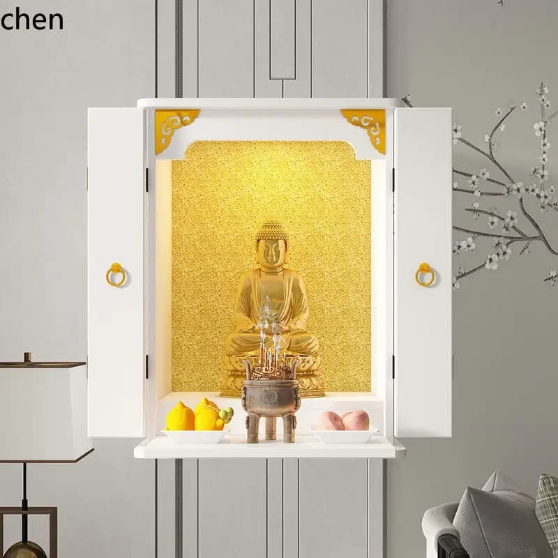 Modern white household Buddha shrine with gold accents and open doors.