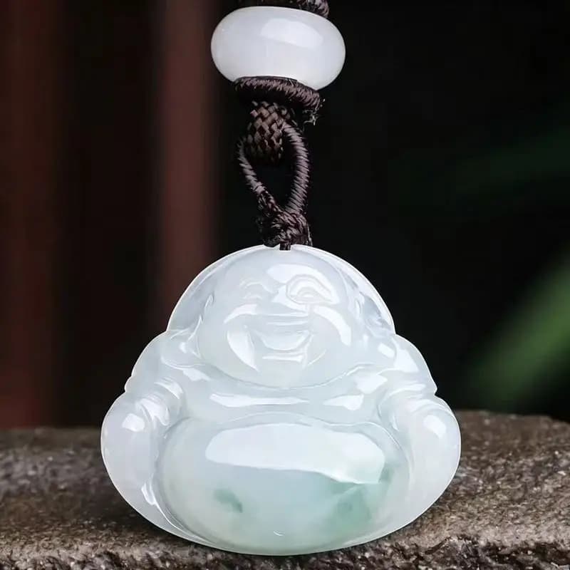 Carved translucent A-grade jadeite Maitreya Buddha pendant with a braided cord.