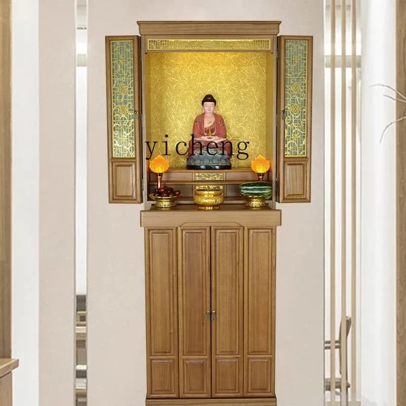 An elegantly crafted vertical wooden Buddhist shrine cabinet with doors open displaying a sacred niche for deities.