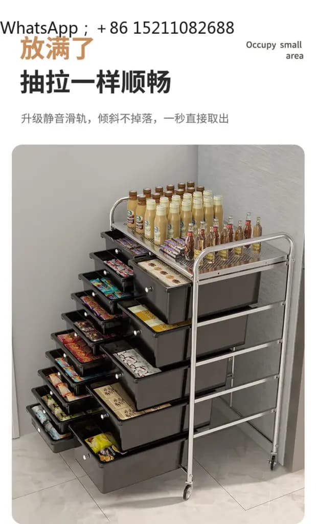 Black multi-tier mobile storage cabinet on wheels filled with snacks and beverages.